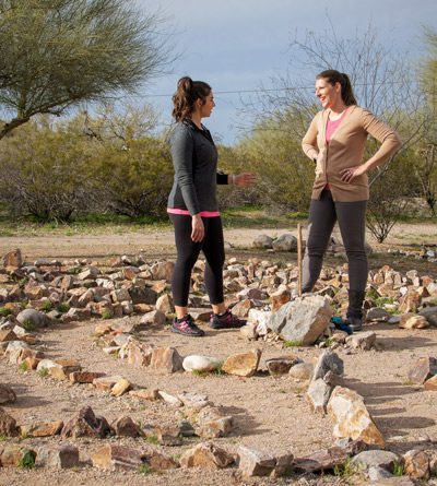 two women talking in labyrinth - Cottonwood Tucson - Experiential Therapy
