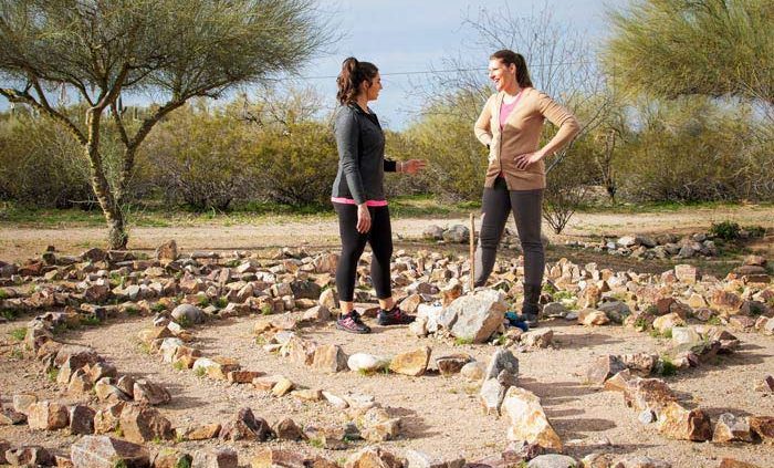 two women in labyrinth talking - Cottonwood Tucson holistic treatment for mood disorders and addiction