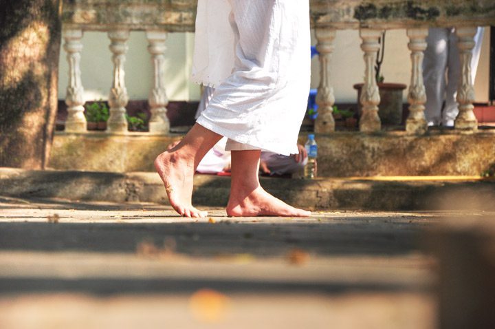cropped shot of person's feet walking outside barefoot - walking meditation - meditation styles